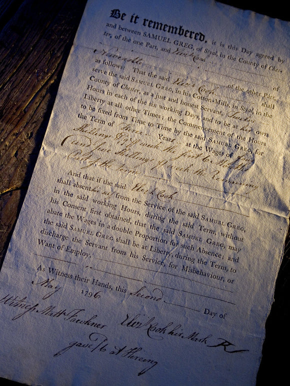 A close up of a contract between Samuel Greg, owner of Quarry Bank Mill, Styal, and a worker named Cook, dated May 1796