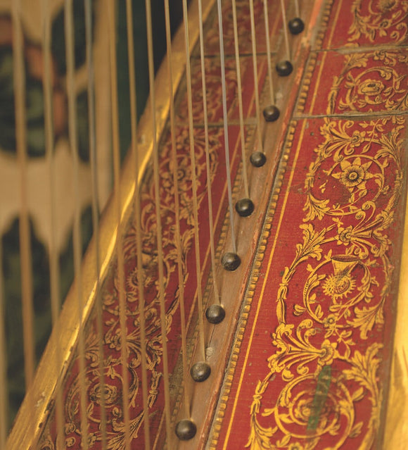 Close view of part of the mid-C19th harp made by Delveau in the Grey Room at Snowshill Manor