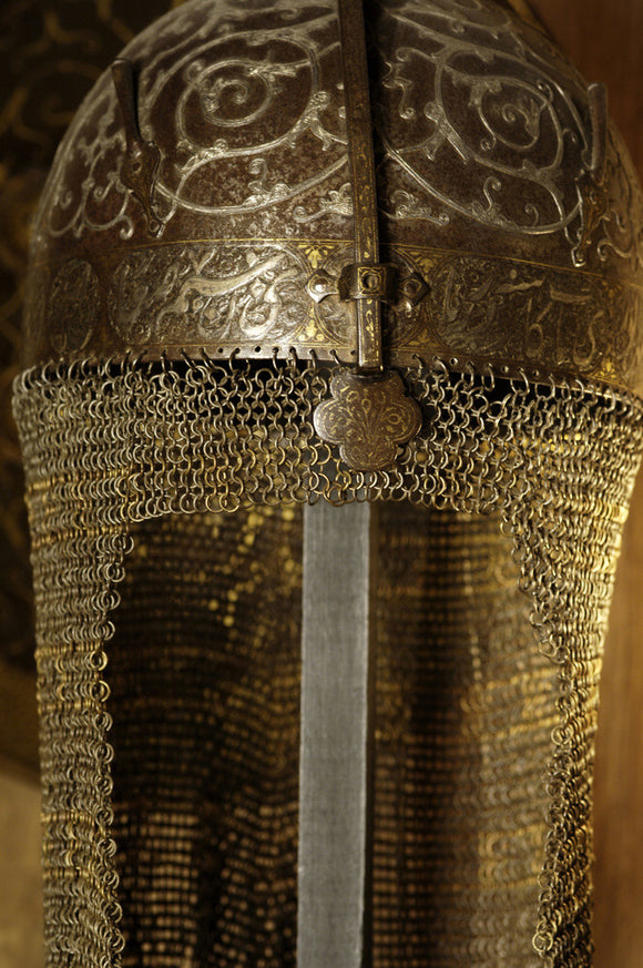Detail of a steel Indo-Persian helmet with chain mail and a nasal guard, part of the Charles Wade collection, in Seraphim at Snowshill Manor, Gloucestershire