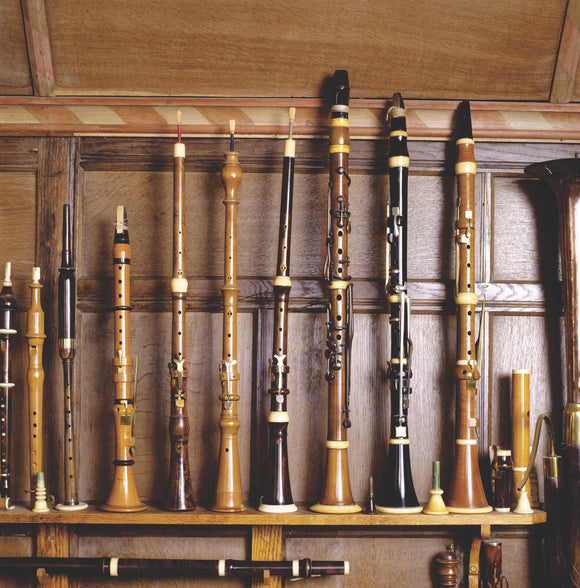 Detail of flageolets, oboes & clarinets, c.1800-1820, displayed on a shelf in the Music Room at Snowshill Manor.