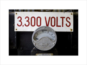 Close up of mining equipment - an electricty meter and volatge notice