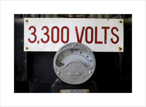 Close up of mining equipment - an electricty meter and volatge notice