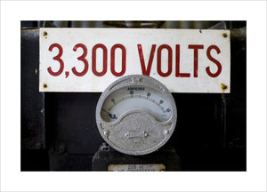 Close up of mining equipment - an electricty meter and volatge notice