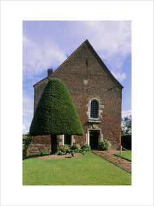 Tattershall Castle, view of fifteenth century guardhouse with coat of arms and original roof with tie beams, braced crown posts and collar purlins