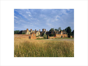 A view over a grassy field of Packwood House, Warwickshire from the east