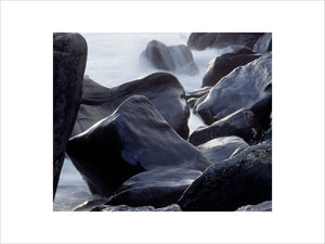 A detailed close up of sodden rocks on the coastline of Murlough Bay, Northern Island