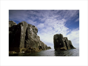 A view of "The Pinnacles", a set of cliffs that rise vertically out of the sea, part of Staple Island in the Farne Islands