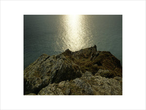 A view looking straight down over the jagged rocks at Dodman Point