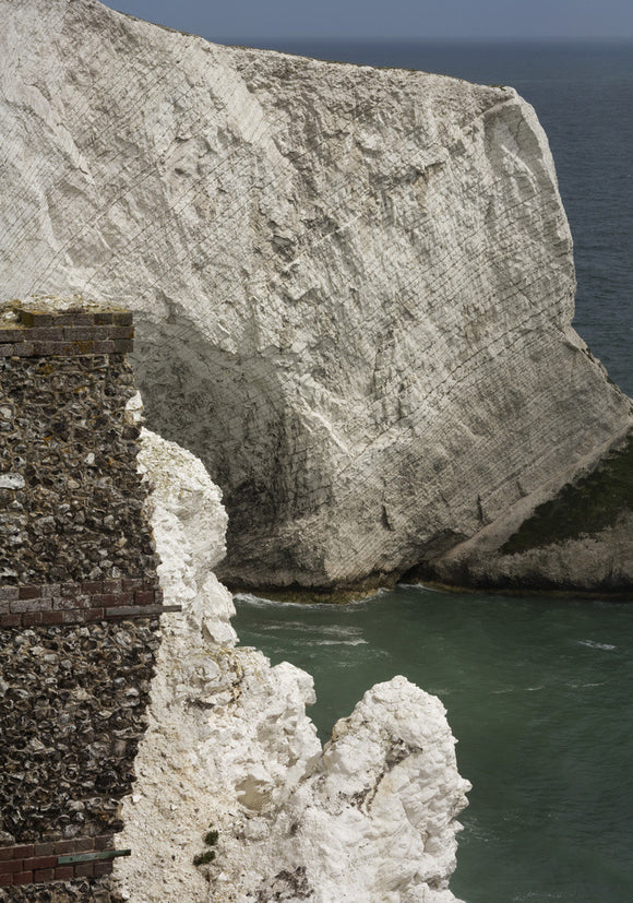 A view from the Needles Old Battery, built in 1862 following the threat of a French invasion, over the sheer chalk cliffs into Scratchell's Bay of the far western point of the Isle of Wight