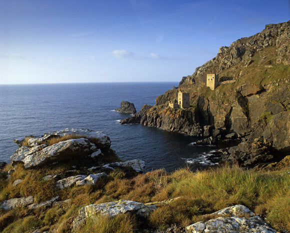 A distant view of the ruined engine houses of Botallack Mine on the St Just coast
