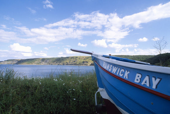 A boat at Runswick Bay, with the name 'Runswick Bay' on the side of it