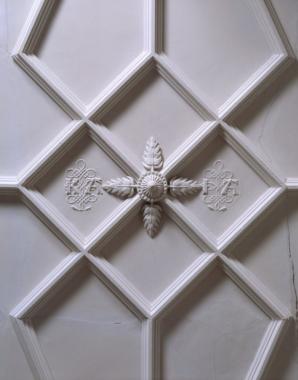 Detail of the plasterwork ceiling in the Hall at Trerice showing an ornamental section decorated with the initials K.A.