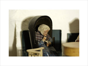 Close view of one of the figures of an old lady, one of a pair, which were popular golden wedding gifts