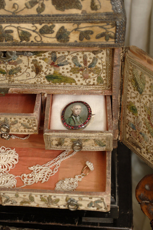 Close view of jewellery and the drawers of the C17th stumpwork box in which it is kept, part of the Charles Wade collection, in Occidens, the room which used to house the costume collection, Snowshill Manor