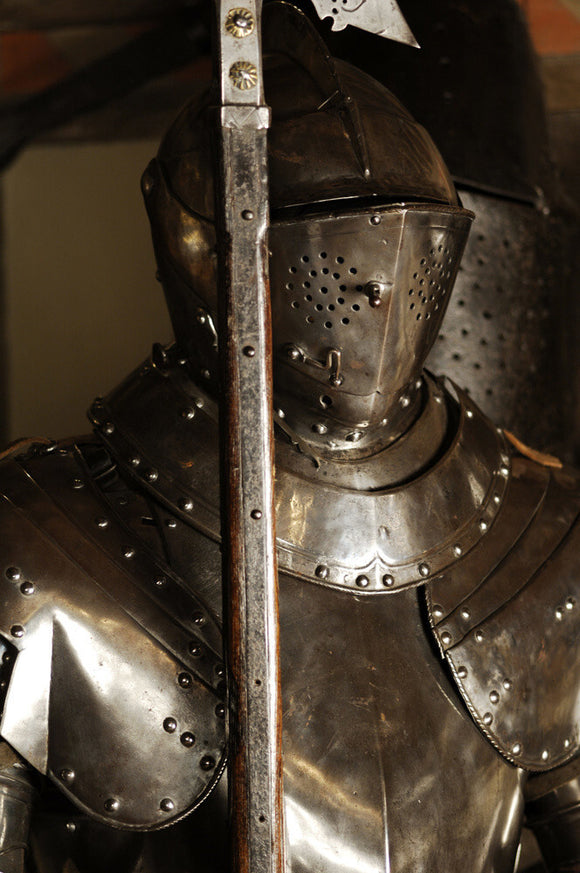 Close view of parts of a three-quarter suit of German armour at Snowshill Manor, in the room known as Dragon