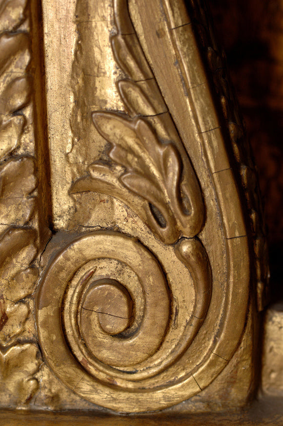 Detail of part of a French red lacquered cabinet stand in the Grey Room at Snowshill Manor, home of the collector Charles Wade