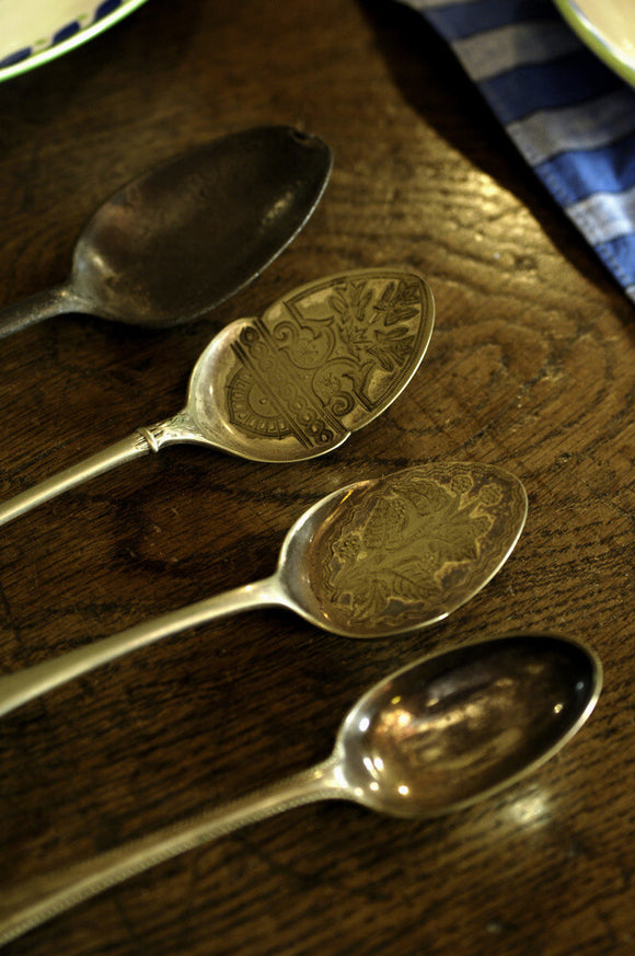 Jam spoons with chased floral decoration, part of the collection in the Living Room at the Priest's House, Snowshill Manor