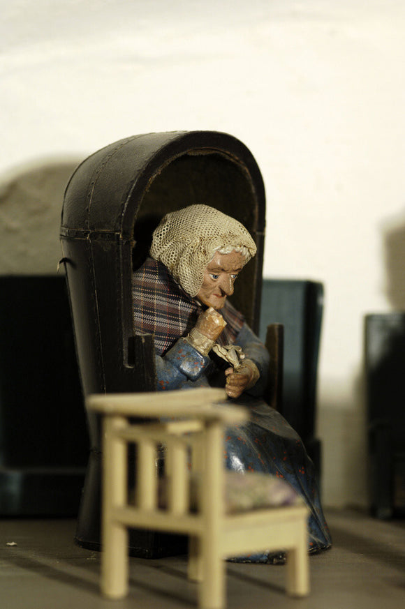 Close view of one of the figures of an old lady, one of a pair, which were popular golden wedding gifts