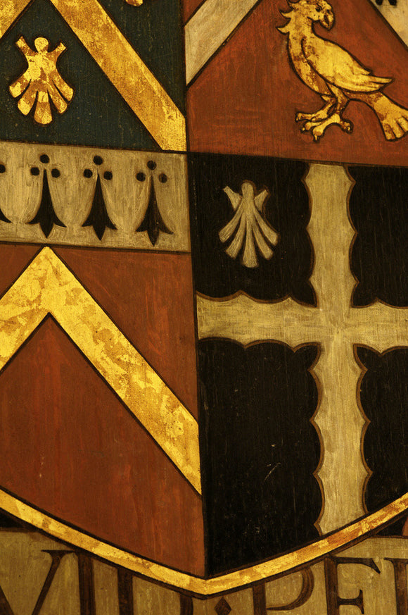 Close view of the Wade family coat of arms in the Entrance Hall at Snowshill Manor, Gloucestershire
