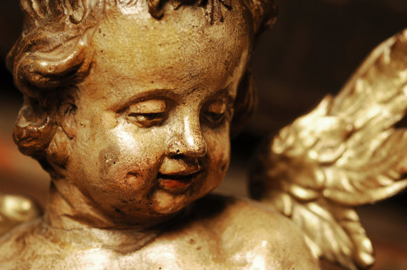 Close view of a gilded wooden cherub, Italian, C18th, in Dragon at Snowshill Manor