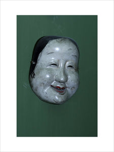 Japanese "No" theatre mask, part of the Charles Wade collection, in the Green Room at Snowshill Manor