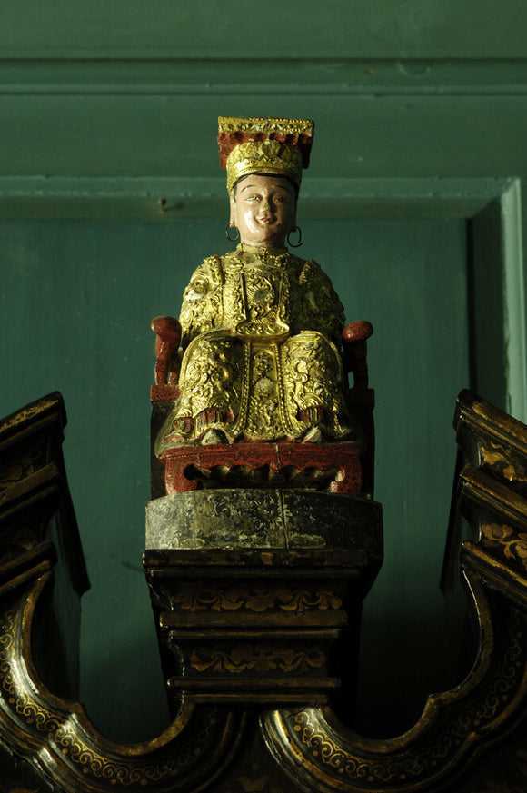 An Indonesian figure, part of Charles Paget Wade's collection, in the Turquoise Hall at Snowshill Manor, Gloucestershire