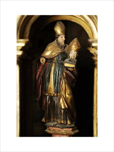 A carved figure of St Firmin, in golden gesso, in Meridian at Snowshill Manor, Gloucestershire, home of Charles Paget Wade