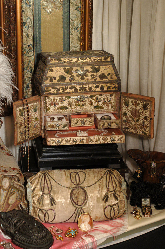 Close view of jewellery and the C17th stumpwork box in which it is kept