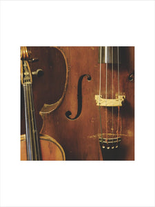 A double bass, part of the musical instrument collection of Charles Paget Wade in the Music Room at Snowshill Manor, Gloucestershire