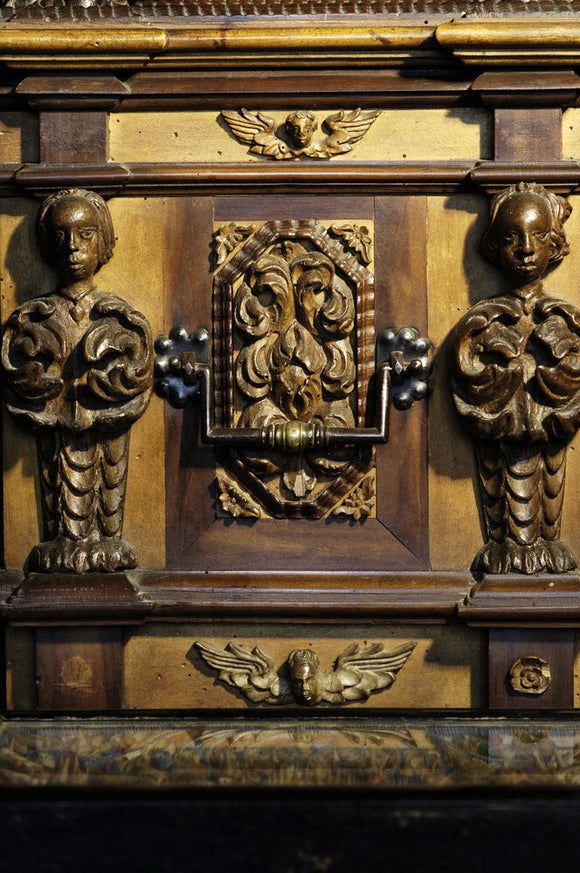 Detail of the carvings on an Italian carved chest of 1698 in Ann's Room at Snowshill Manor