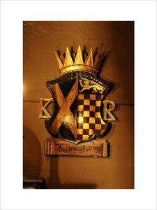 The coat of arms of Kenulf 13th, King of Mercia, on the wall of Dragon at Snowshill Manor