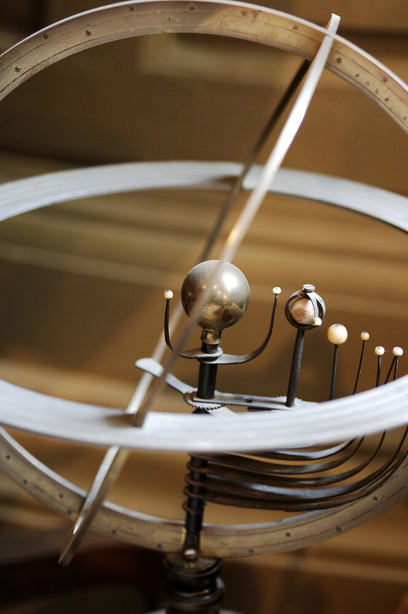 An armillary helicentric planetarium, French, C19th, in Admiral at Snowshill Manor, Gloucestershire