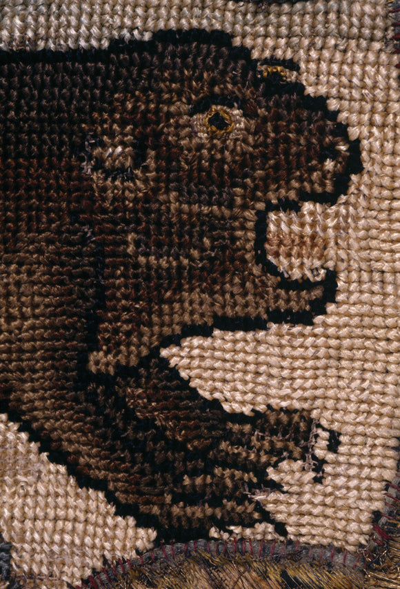 The head and fore-legs of a beaver from a motif on the Marian Needlework at Oxburgh Hall
