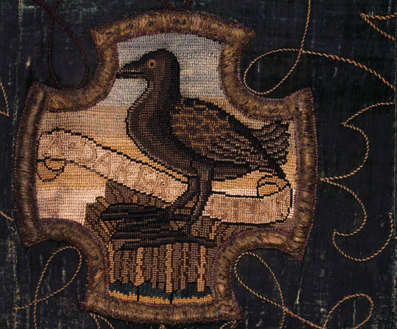 A bird on a motif of the Marian Needlework at Oxburgh Hall