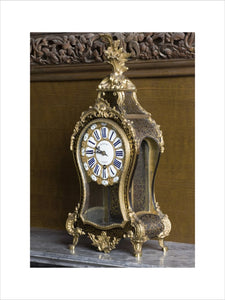 Ormolu-mounted Boulle bracket clock (1715-1723) by Minoche of Paris in the Carved Room at Petworth House, West Sussex