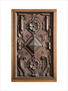 Close view of part of the wooden carving on the door panels of the Library in the new house at Scotney Castle, Kent