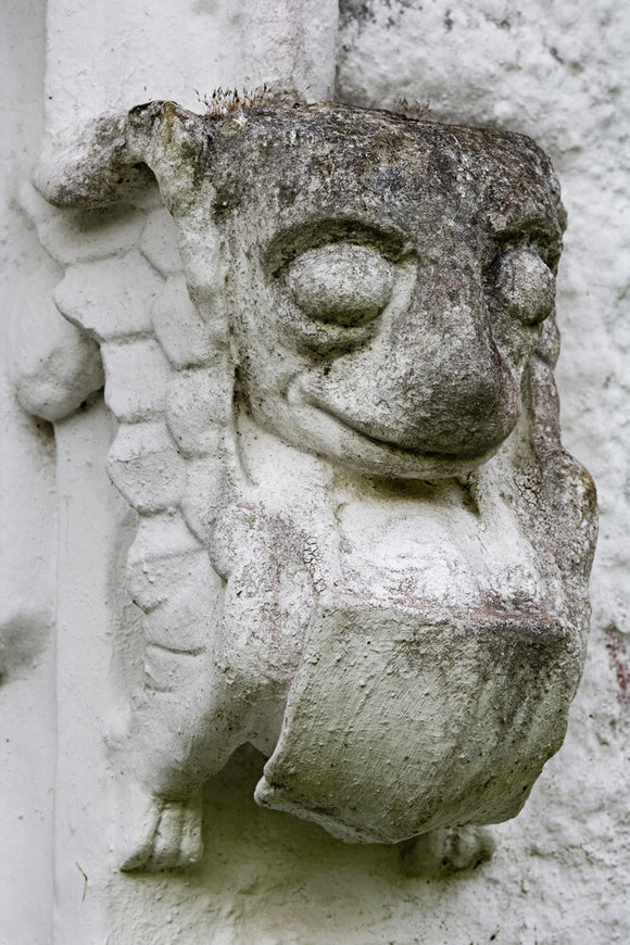 Scaled creature, part of the stonework on the east front at Bradley Manor, a medieval manor house at Newton Abbot, Devon