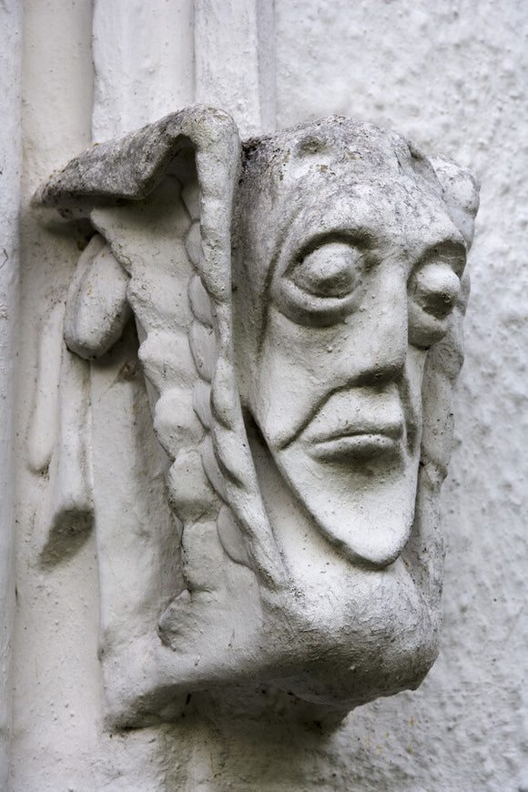 Grotesque face on east front of Bradley Manor, a medieval manor house at Newton Abbot, Devon