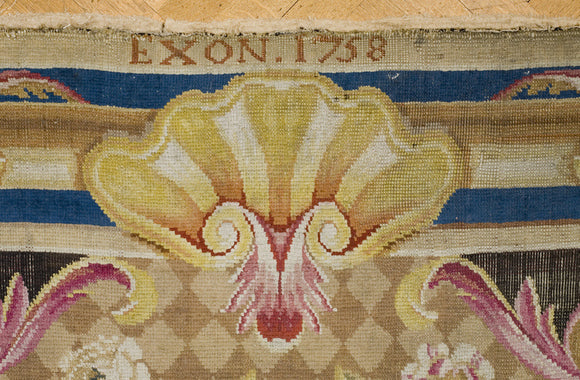 Detail of the Exeter carpet, dated EXON 1758, on the Grand Staircase at Petworth House, West Sussex
