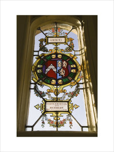 Detail of the lattice-paned windows with roundels and shields of heraldic glass commemorating the marriages of the Throckmorton family with other Catholic families, in the Drawing Room at Coughton Court, Warwickshire