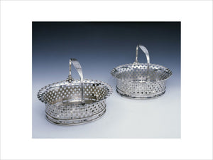 A pair of George II cake baskets by Peter Archambo, 1730/1, (DUN.S.300 & 466), part of the silver collection at Dunham Massey, photographed for the Country House Silver book.