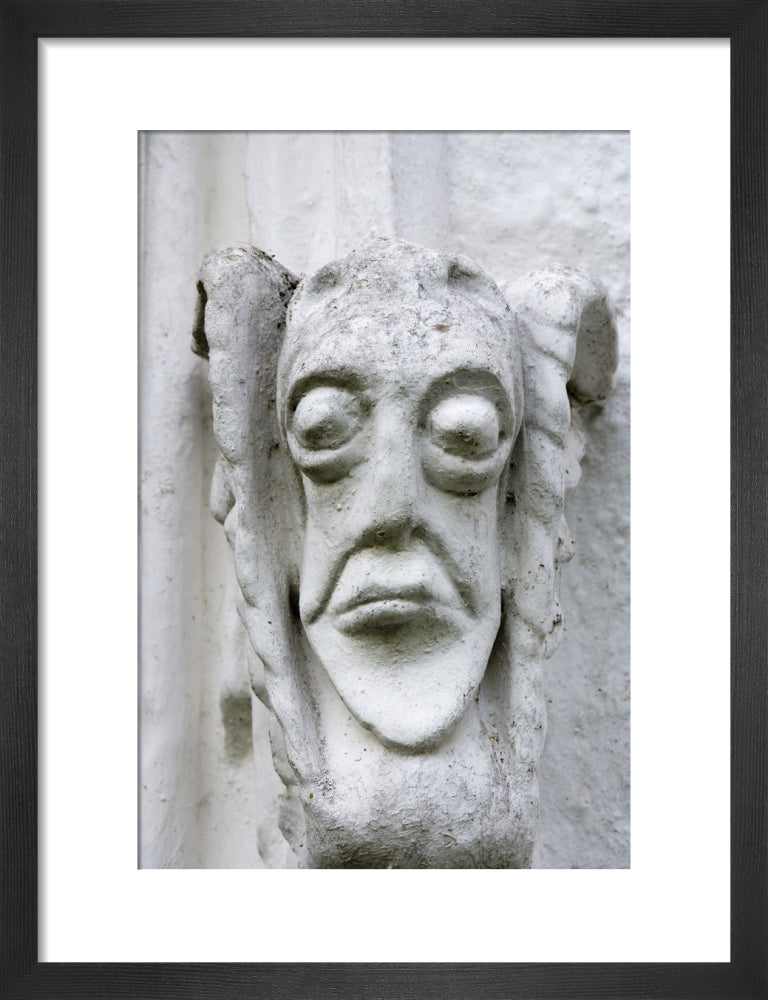 Grotesque face on the east front of Bradley Manor, a medieval manor ho ...