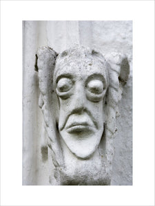 Grotesque face on the east front of Bradley Manor, a medieval manor house at Newton Abbot, Devon