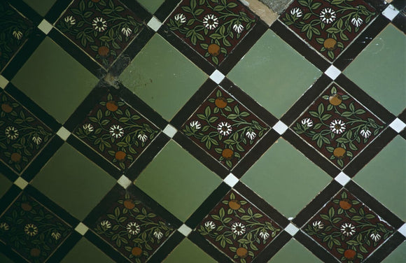 Close up of Victorian tiles in the gazebo in the Old Rose Garden at Tyntesfield, North Somerset