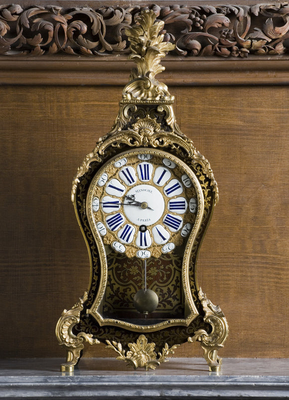 Ormolu-mounted Boulle bracket clock (1715-1723) by Minoche of Paris in the Carved Room at Petworth House, West Sussex