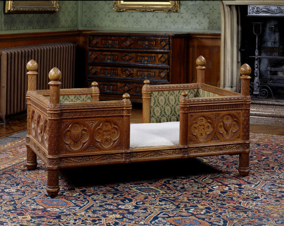 A child's bed made by James Plucknett, adapted from Viollet- le-Duc's Dictionnaire raisonne du mobilier francais 1872-75, at Tyntesfield