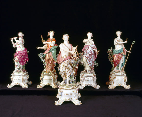 Close view of four Muses & Apollo figures from a larger group