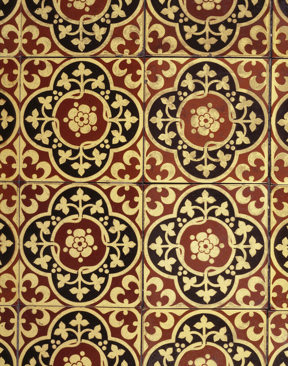 A detail of the Minton tiles on the hearth floor in the fireplace of the Billiard Room at Dunster Castle