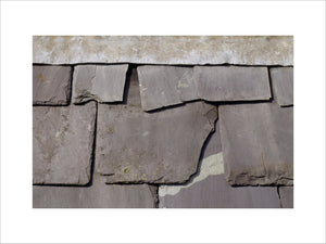 A close up of old and broken slates in need of repair at Dudmaston Hall