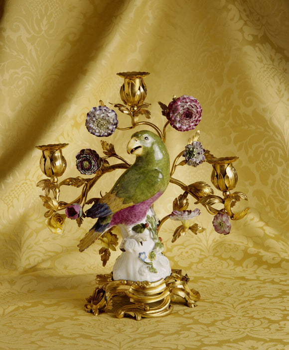 A ceramic parrot mounted on a Louis XV ormolu base candlestick, From the Drawing Room at Fenton House